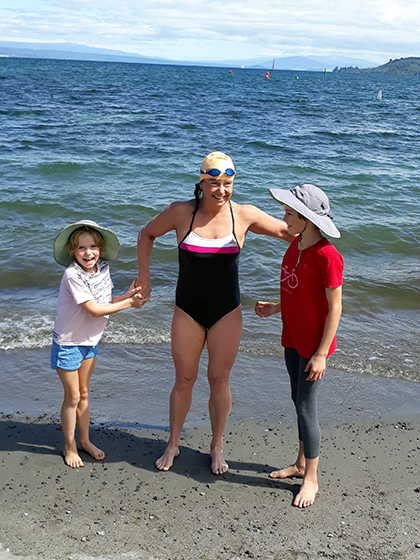 Bronwyn with her kids at swim finish Dr Bronwyn Copeland – Swimming against the tide of P